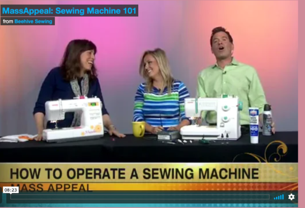 Screenshot from TV of three people and 2 sewing machines